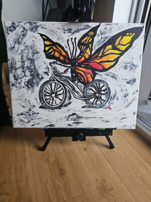 butterfly bike painting on an easel