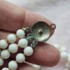 p1-596.jpg Vintage Triple Strand Milk Glass Bead Necklace unusual clasp